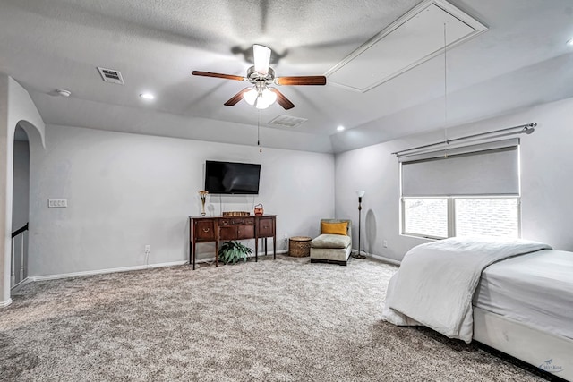 7016 Spur Ranch Rd, Odessa, TX 79765 - bedroom with attic access, carpet, lofted ceiling, recessed lighting, and arched walkways