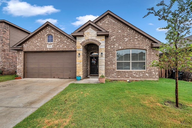7016 Spur Ranch Rd, Odessa, TX 79765 - french country inspired facade featuring brick siding, driveway, a garage, and a front lawn