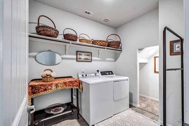 7016 Spur Ranch Rd, Odessa, TX 79765 - washroom with washing machine and clothes dryer and light wood finished floors