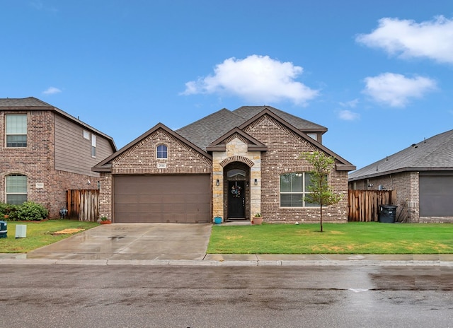 7016 Spur Ranch Rd, Odessa, TX 79765 - view of front facade featuring brick siding, an attached garage, driveway, and roof with shingles