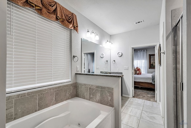 7016 Spur Ranch Rd, Odessa, TX 79765 - ensuite bathroom featuring a whirlpool tub, marble finish flooring, and vanity