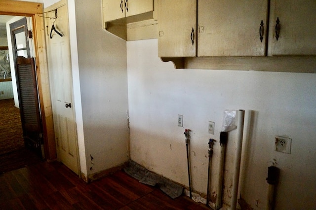 708 W Yukon Rd, Odessa, TX 79764 - laundry area with wood finished floors and cabinet space