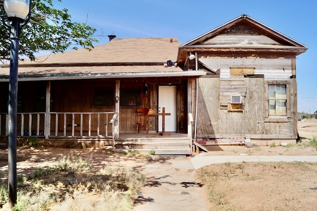 708 W Yukon Rd, Odessa, TX 79764 - view of front of house featuring a porch and roof with shingles