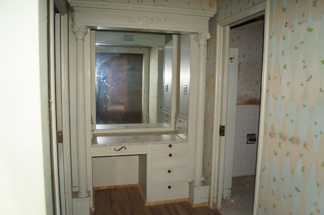 708 W Yukon Rd, Odessa, TX 79764 - corridor with wallpapered walls, wood finished floors, and wainscoting