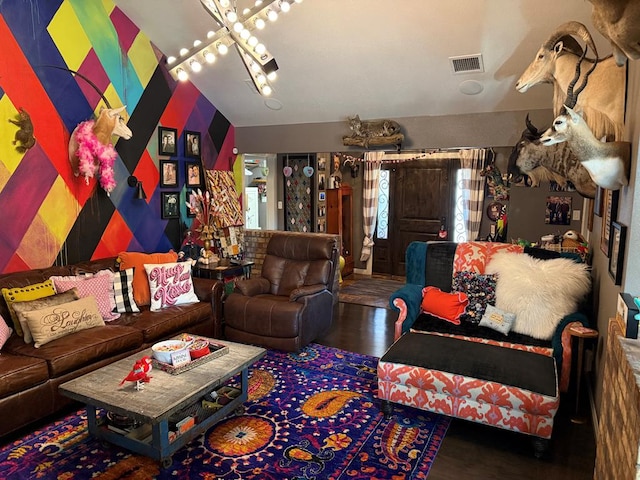 recreation room featuring lofted ceiling with beams and a chandelier