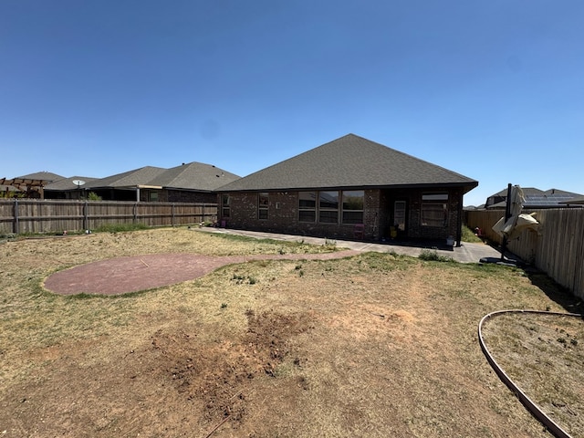 7001 La Escalera Ct, Odessa, TX 79765 - back of property featuring a patio area, a fenced backyard, and brick siding