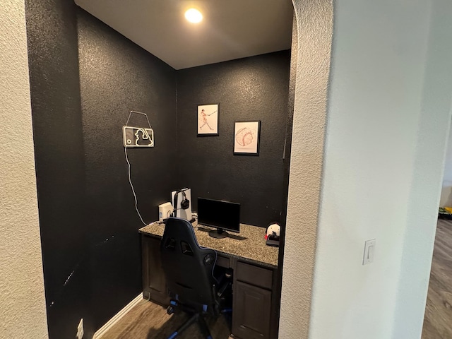 7001 La Escalera Ct, Odessa, TX 79765 - office area featuring wood finished floors and a textured wall