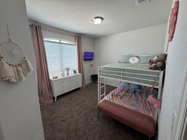 7001 La Escalera Ct, Odessa, TX 79765 - bedroom with carpet flooring, a textured ceiling, and a textured wall