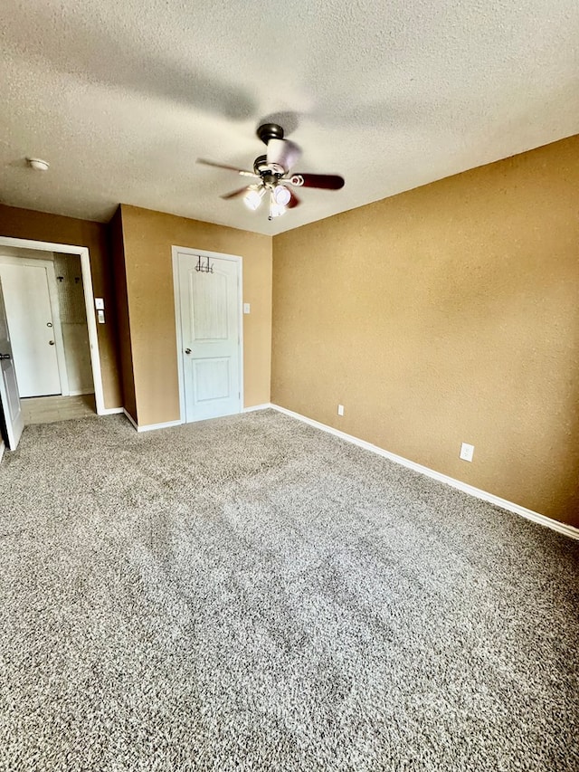 6305 Mecca St, Odessa, TX 79762 - unfurnished bedroom featuring carpet flooring, baseboards, a textured ceiling, and ceiling fan