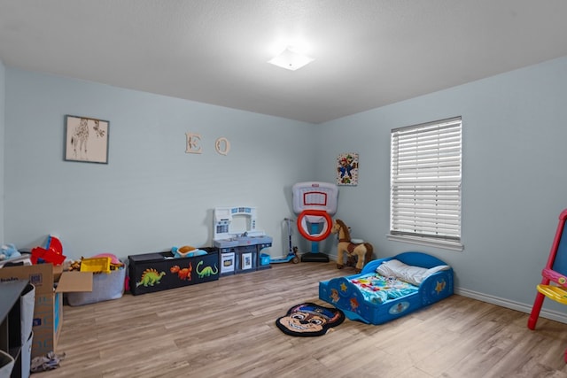 1012 Duke Ave, Odessa, TX 79765 - playroom featuring wood finished floors and baseboards