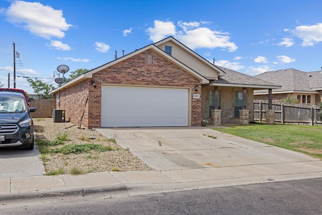 1012 Duke Ave, Odessa, TX 79765 - single story home featuring brick siding, an attached garage, and driveway