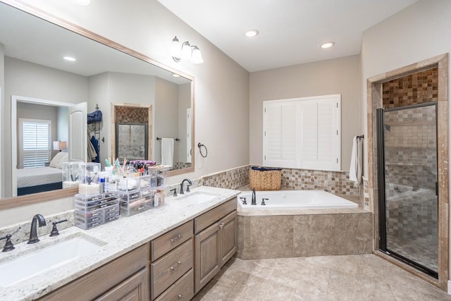 7604 Keyhaven St, Odessa, TX 79765 - ensuite bathroom featuring a garden tub, double vanity, a shower stall, and recessed lighting