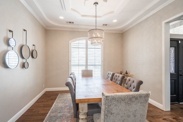 7604 Keyhaven St, Odessa, TX 79765 - dining room with a tray ceiling, crown molding, and dark wood-style floors
