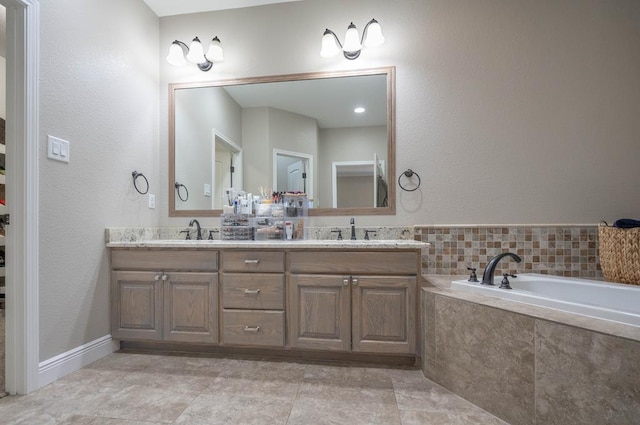 7604 Keyhaven St, Odessa, TX 79765 - bathroom with double vanity and a bath