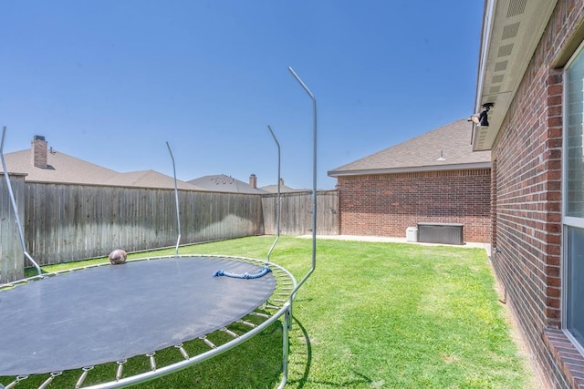7604 Keyhaven St, Odessa, TX 79765 - fenced backyard featuring a trampoline