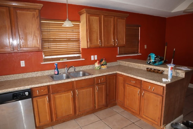 1642 S Plum Ave, Pecos, TX 79772 - kitchen with stainless steel dishwasher, a sink, a peninsula, brown cabinets, and light tile patterned floors