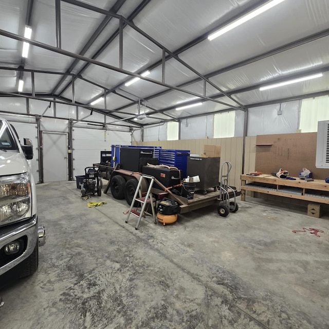 9935 W Yukon Rd, Odessa, TX 79764 - garage with a garage door opener and a workshop area