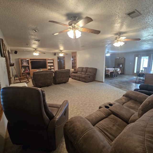 9935 W Yukon Rd, Odessa, TX 79764 - living area with a textured ceiling, ceiling fan, and carpet flooring