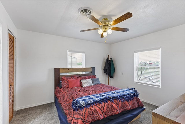 1908 W 36th St, Monahans, TX 79756 - carpeted bedroom featuring baseboards and ceiling fan