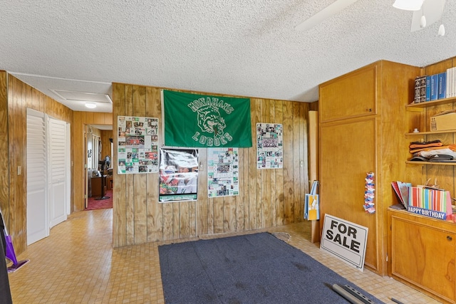 1908 W 36th St, Monahans, TX 79756 - interior space with wooden walls and a textured ceiling