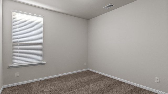 unfurnished room with carpet floors