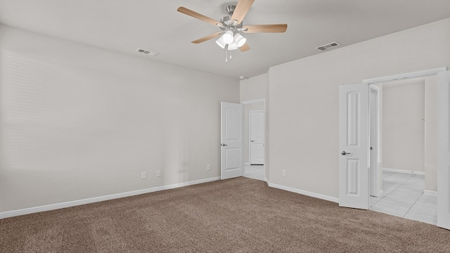 carpeted empty room with ceiling fan