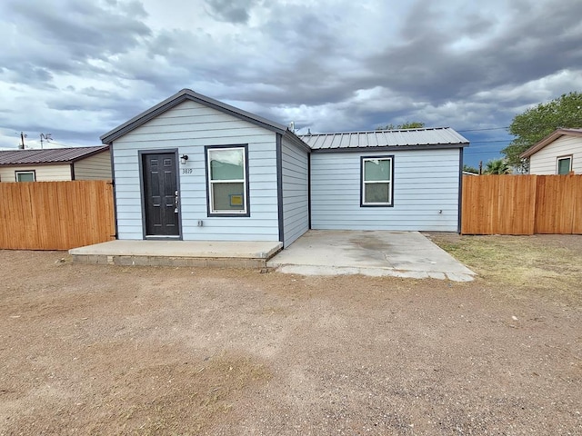 3819 Robertson Ave, Odessa, TX 79764 - back of property featuring a patio and a metal roof
