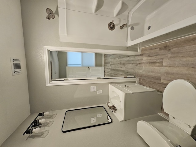 3819 Robertson Ave, Odessa, TX 79764 - bathroom with toilet and backsplash