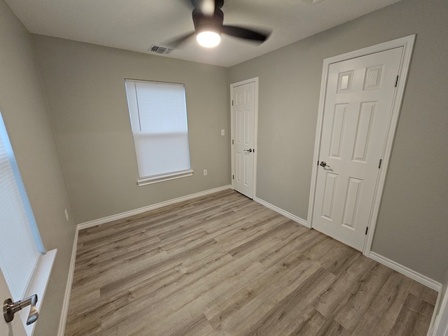 3819 Robertson Ave, Odessa, TX 79764 - unfurnished bedroom with wood finished floors and ceiling fan