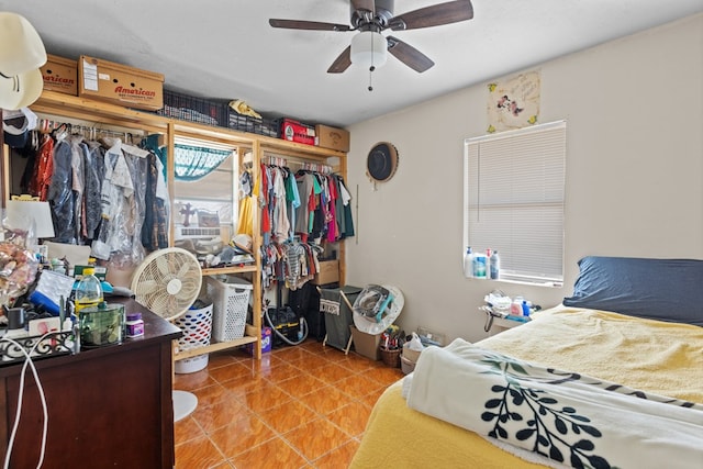 bedroom featuring ceiling fan and a closet