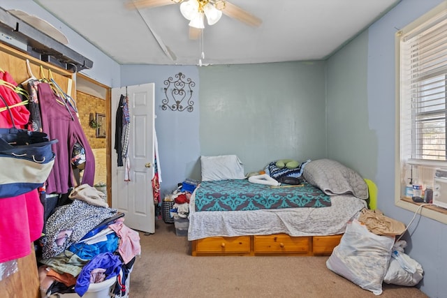 carpeted bedroom featuring ceiling fan