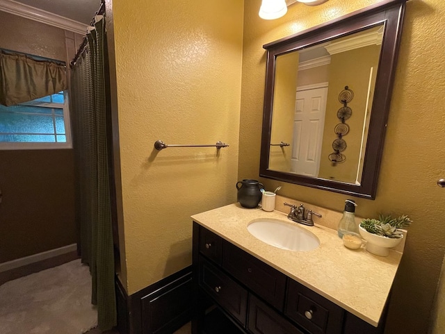 1401 S Franklin Ave, Monahans, TX 79756 - full bathroom featuring crown molding, vanity, and a textured wall