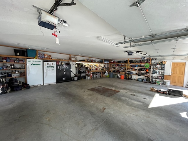 1401 S Franklin Ave, Monahans, TX 79756 - garage featuring a workshop area and a garage door opener