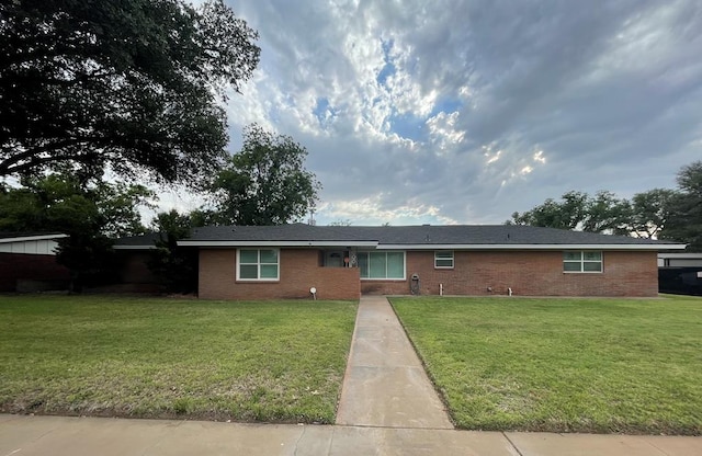 1401 S Franklin Ave, Monahans, TX 79756 - single story home with a front lawn and brick siding
