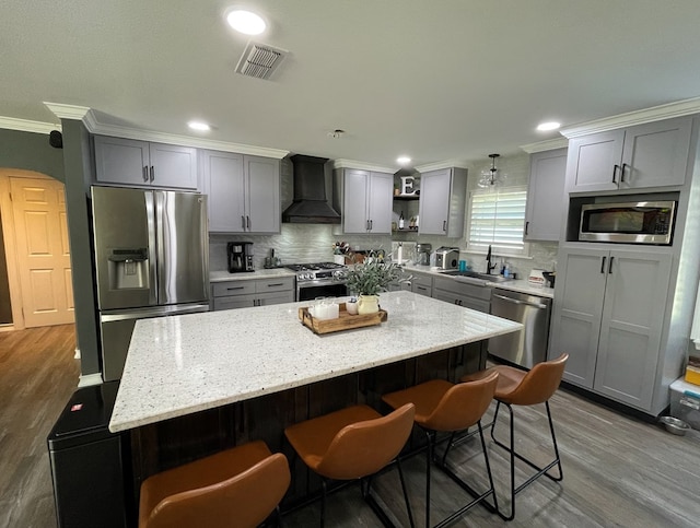 1401 S Franklin Ave, Monahans, TX 79756 - kitchen with custom exhaust hood, stainless steel appliances, open shelves, crown molding, and backsplash