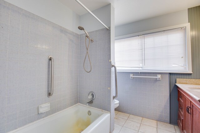 2802 Windsor Dr, Odessa, TX 79762 - full bath with vanity, tile patterned floors, shower / bath combination, toilet, and tile walls