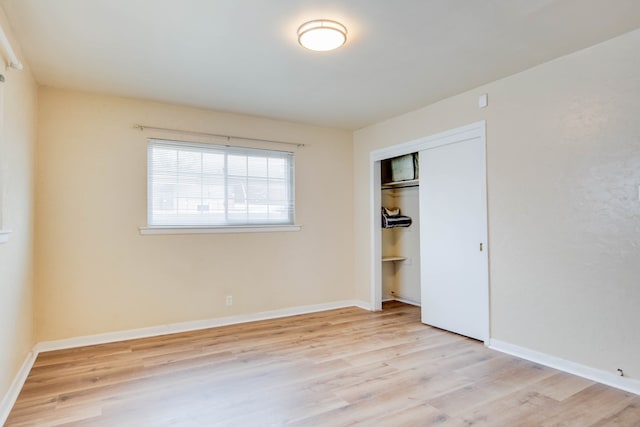 2802 Windsor Dr, Odessa, TX 79762 - unfurnished bedroom featuring light wood finished floors, baseboards, and a closet