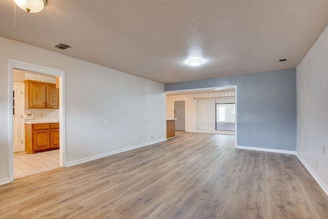 2802 Windsor Dr, Odessa, TX 79762 - spare room featuring light wood-type flooring and baseboards
