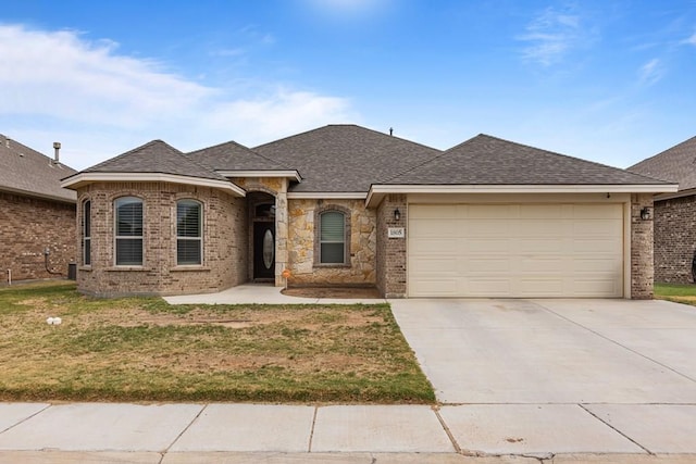 1805 Bourbon St, Odessa, TX 79765 - french provincial home with driveway, brick siding, and a front yard
