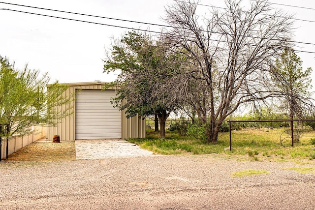 2202 S Ike Ave, Monahans, TX 79756 - garage featuring gravel driveway
