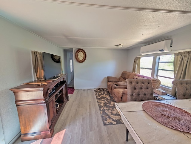 403 Commerce St, Fort Davis, TX 79734 - living area with light wood finished floors, baseboards, and an AC wall unit
