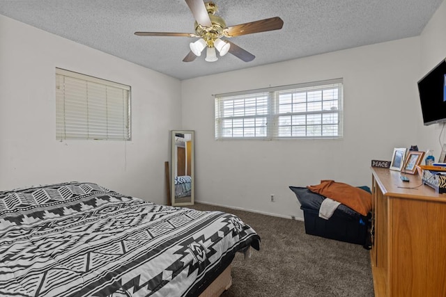 bedroom featuring carpet floors, a textured ceiling, and ceiling fan
