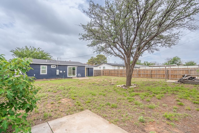 411 N San Jacinto St, Odessa, TX 79762 - fenced backyard with a patio area