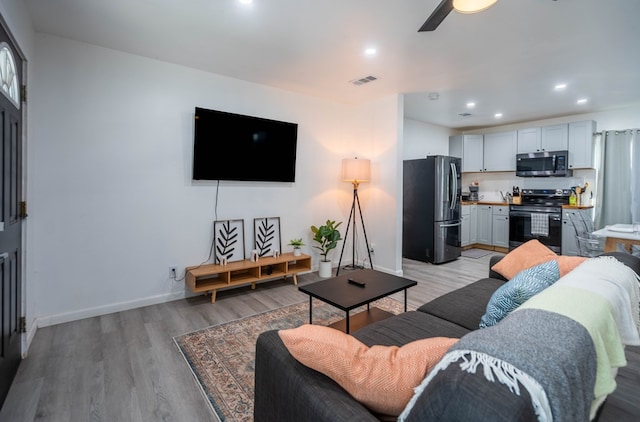 411 N San Jacinto St, Odessa, TX 79762 - living area with light wood-type flooring, recessed lighting, and a ceiling fan