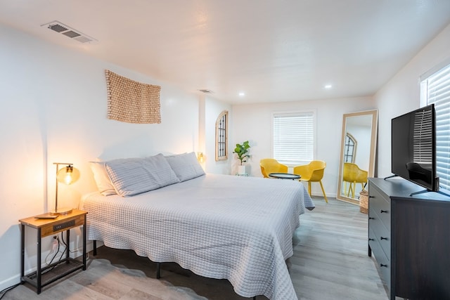 411 N San Jacinto St, Odessa, TX 79762 - bedroom with light wood-style flooring and recessed lighting