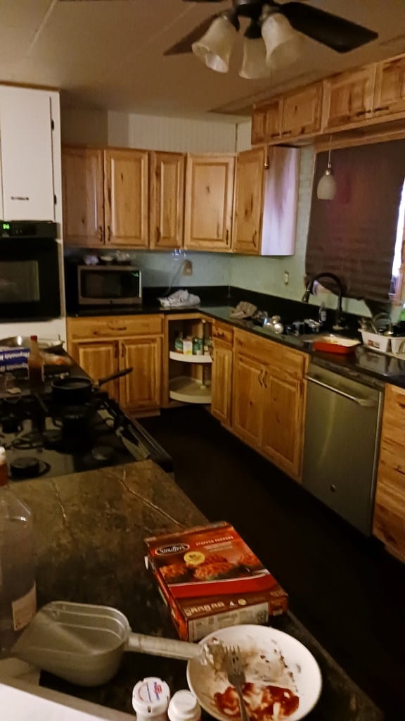 302 E 67th St, Odessa, TX 79762 - kitchen featuring appliances with stainless steel finishes, dark countertops, and a ceiling fan