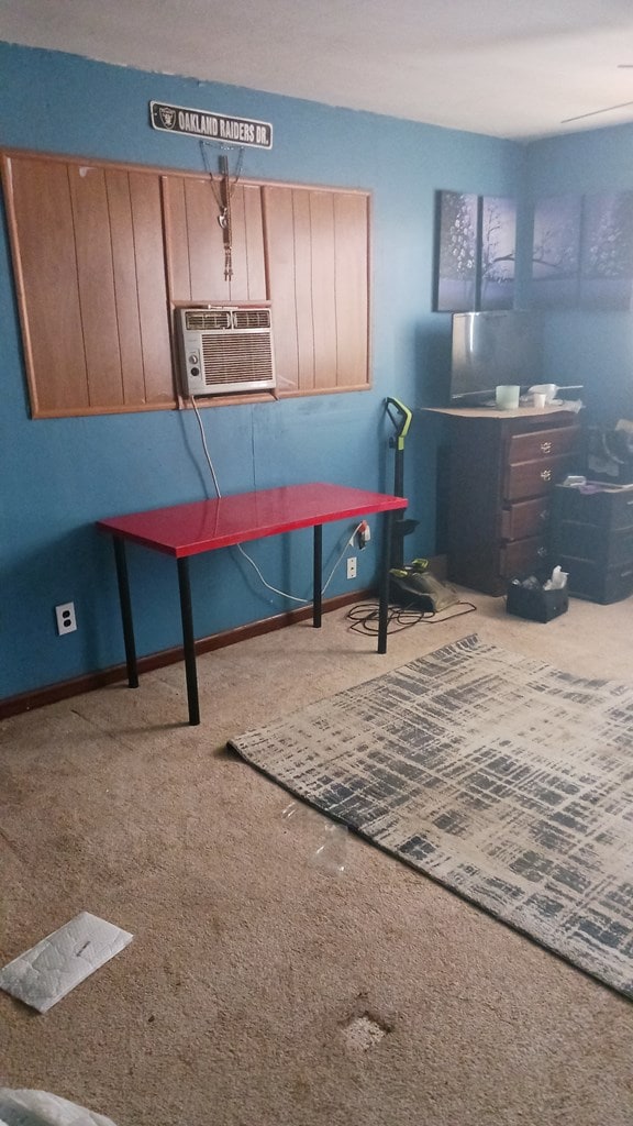 302 E 67th St, Odessa, TX 79762 - carpeted office space featuring a wall unit AC and baseboards