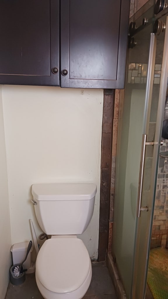 302 E 67th St, Odessa, TX 79762 - bathroom with a stall shower and toilet