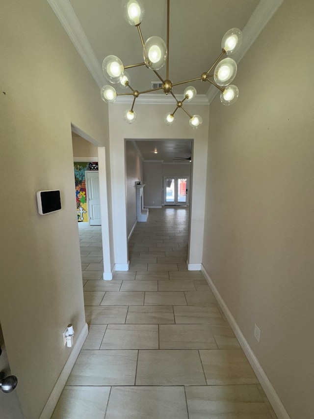 corridor with a chandelier and ornamental molding