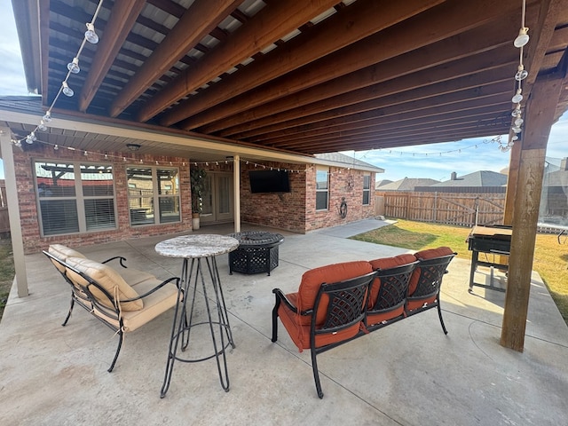 view of patio featuring an outdoor fire pit